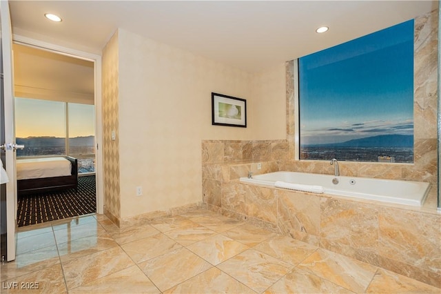 2000 Fashion Show Dr Unit 5022, Las Vegas, NV 89109 - ensuite bathroom featuring a garden tub, recessed lighting, and marble finish floors