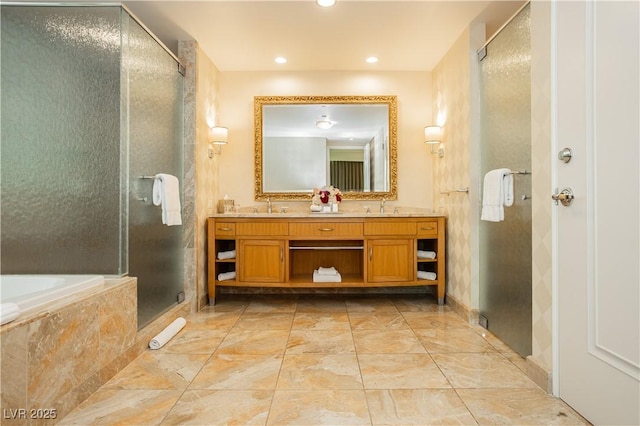 2000 Fashion Show Dr Unit 5022, Las Vegas, NV 89109 - full bathroom with a stall shower, double vanity, marble look tiles, a garden tub, and recessed lighting