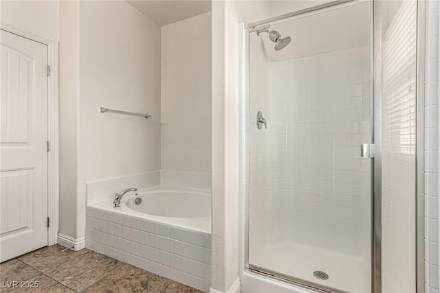 1034 Fish Pond Ave, Henderson, NV 89014 - full bathroom with a shower stall, a garden tub, and tile patterned floors