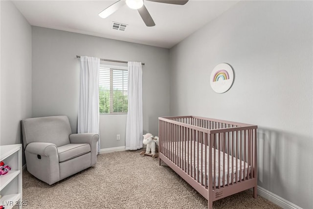 1034 Fish Pond Ave, Henderson, NV 89014 - bedroom with carpet, a crib, and a ceiling fan