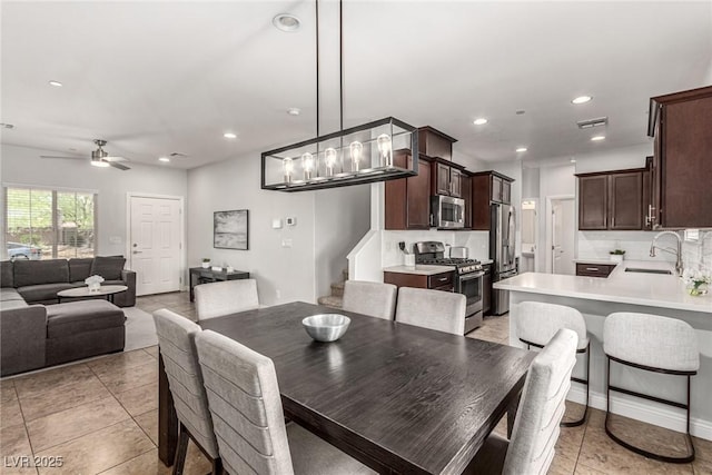 1034 Fish Pond Ave, Henderson, NV 89014 - dining area featuring recessed lighting, ceiling fan, and light tile patterned flooring