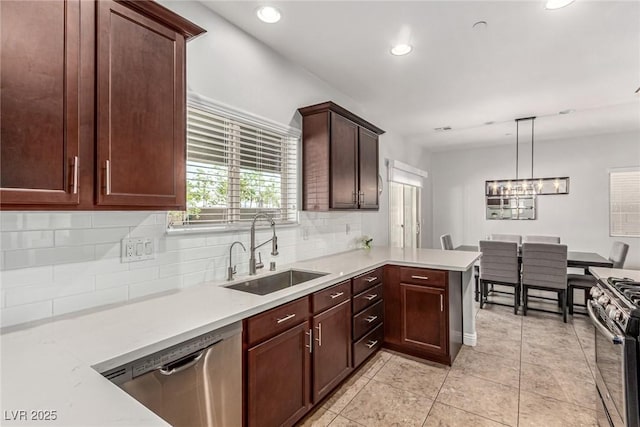 1034 Fish Pond Ave, Henderson, NV 89014 - kitchen featuring appliances with stainless steel finishes, tasteful backsplash, light countertops, and recessed lighting