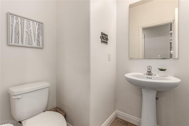 1034 Fish Pond Ave, Henderson, NV 89014 - bathroom featuring toilet and baseboards