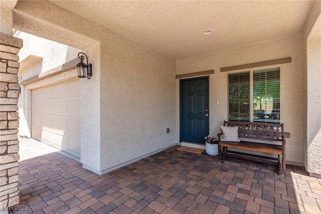 1034 Fish Pond Ave, Henderson, NV 89014 - doorway to property with stucco siding and a garage