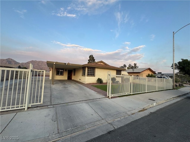 706 Red Lake Way, Las Vegas, NV 89110 - ranch-style home with stucco siding, concrete driveway, a fenced front yard, and a gate