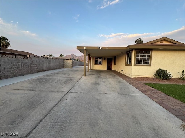 706 Red Lake Way, Las Vegas, NV 89110 - view of front of property featuring concrete driveway, stucco siding, and an attached carport