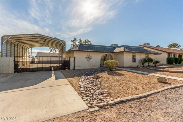 5905 Paseo Montana, Las Vegas, NV 89108 - view of front of home featuring a carport, concrete driveway, and stucco siding