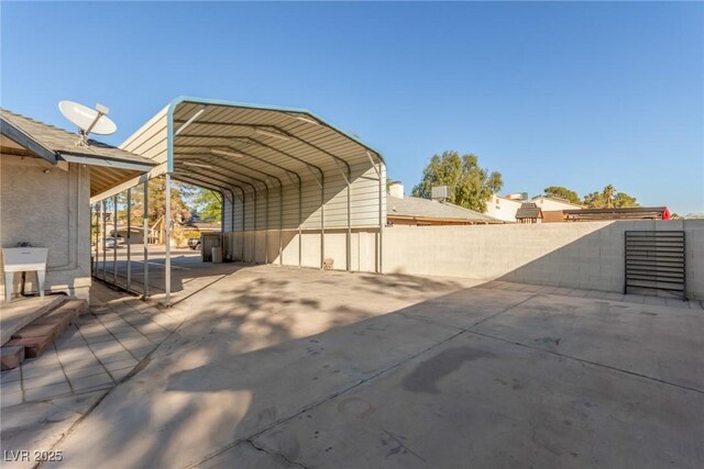 5905 Paseo Montana, Las Vegas, NV 89108 - view of parking featuring a detached carport and driveway