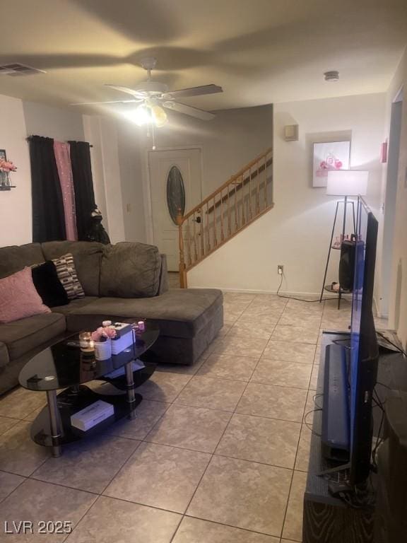 3128 Spring City Ave, North Las Vegas, NV 89081 - living area featuring light tile patterned flooring, ceiling fan, and stairway