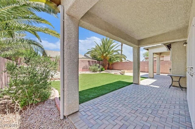 5918 Terra Grande Ave, Las Vegas, NV 89122 - fenced backyard featuring a patio area