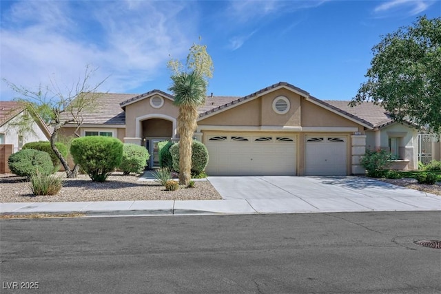 2262 Alanhurst Dr, Henderson, NV 89052 - single story home with an attached garage, stucco siding, concrete driveway, and a tiled roof