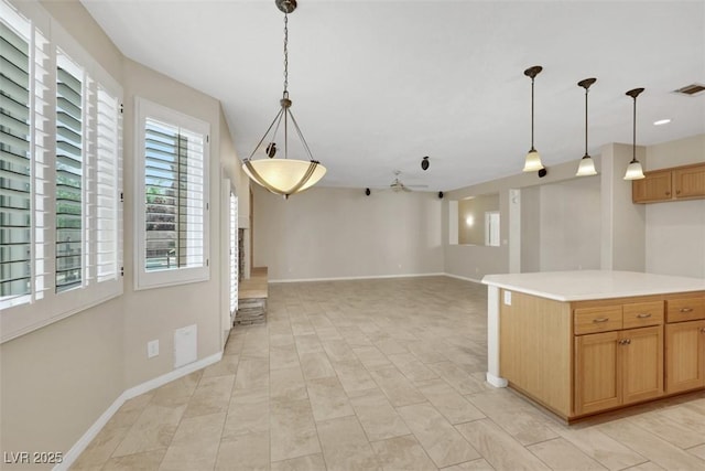 2262 Alanhurst Dr, Henderson, NV 89052 - kitchen with pendant lighting, light countertops, ceiling fan, and open floor plan
