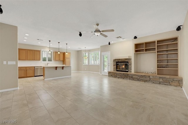 2262 Alanhurst Dr, Henderson, NV 89052 - unfurnished living room with a ceiling fan, a stone fireplace, and recessed lighting
