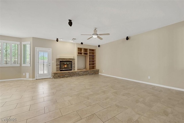 2262 Alanhurst Dr, Henderson, NV 89052 - unfurnished living room featuring ceiling fan, built in features, and a fireplace