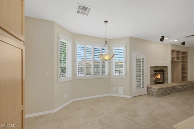 2262 Alanhurst Dr, Henderson, NV 89052 - unfurnished living room with a stone fireplace and light tile patterned floors