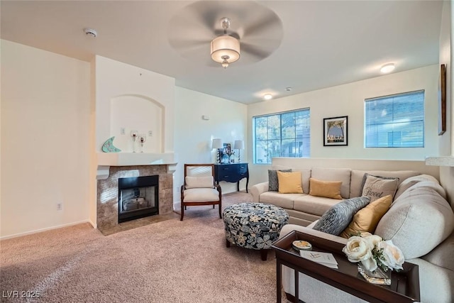 9050 Warm Springs Rd Unit 2050, Las Vegas, NV 89148 - carpeted living area featuring a tiled fireplace and baseboards