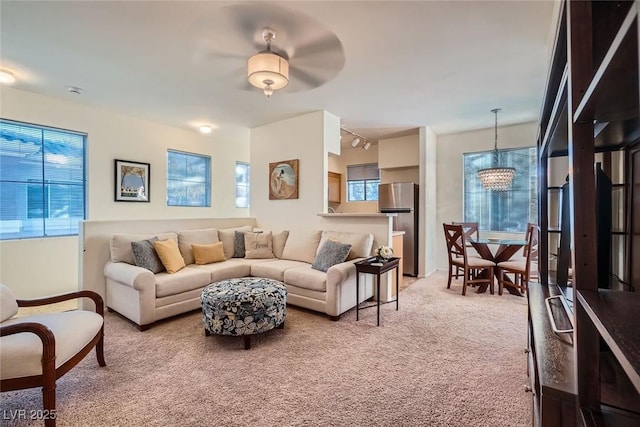9050 Warm Springs Rd Unit 2050, Las Vegas, NV 89148 - living area featuring light colored carpet and a chandelier
