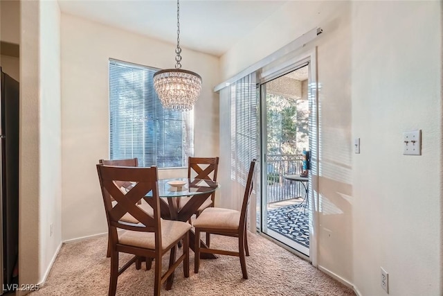 9050 Warm Springs Rd Unit 2050, Las Vegas, NV 89148 - dining area featuring light colored carpet and a chandelier
