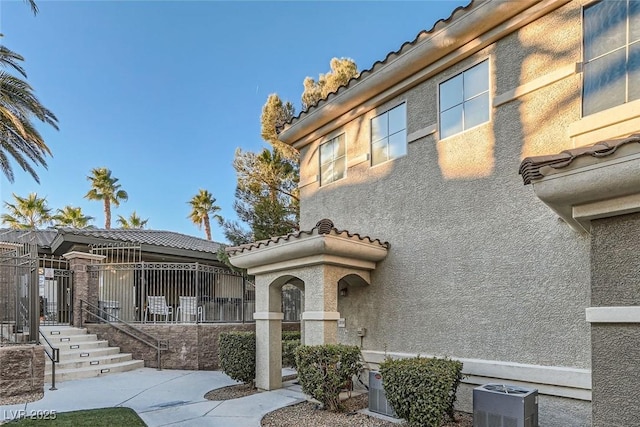 9050 Warm Springs Rd Unit 2050, Las Vegas, NV 89148 - view of front of home featuring a tile roof and stucco siding