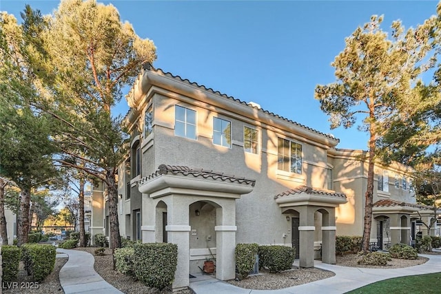 9050 Warm Springs Rd Unit 2050, Las Vegas, NV 89148 - view of front of home with a tiled roof and stucco siding