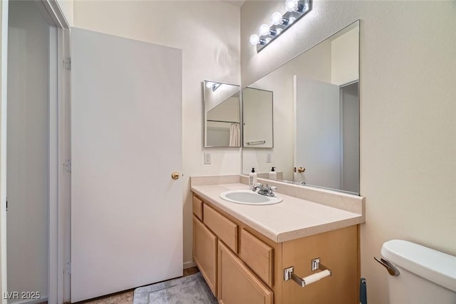 9050 Warm Springs Rd Unit 2050, Las Vegas, NV 89148 - bathroom featuring vanity and toilet
