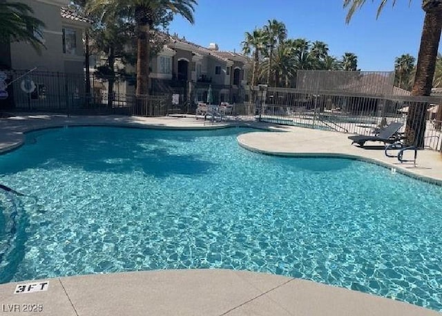9050 Warm Springs Rd Unit 2050, Las Vegas, NV 89148 - community pool featuring a patio