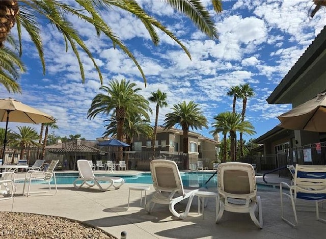 9050 Warm Springs Rd Unit 2050, Las Vegas, NV 89148 - community pool with a patio area