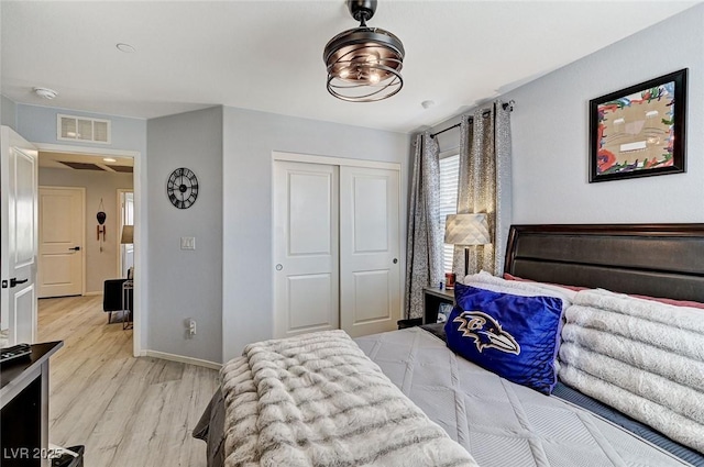 2370 Via Firenze, Henderson, NV 89044 - bedroom featuring light wood-type flooring and a closet