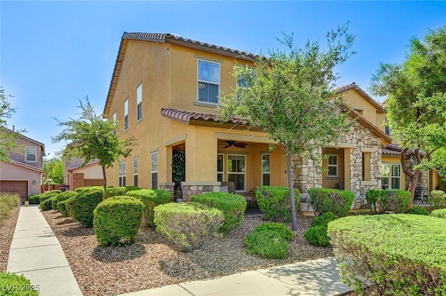 2370 Via Firenze, Henderson, NV 89044 - view of front of home featuring ceiling fan, stucco siding, a tiled roof, and stone siding