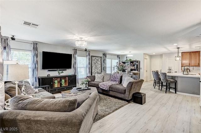 2370 Via Firenze, Henderson, NV 89044 - living area with plenty of natural light and light wood-style flooring