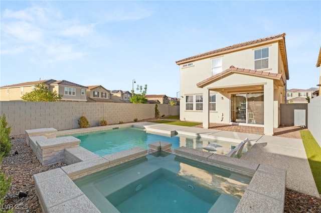 2833 Sangro Ct, Henderson, NV 89044 - view of swimming pool with a fenced backyard, a residential view, a pool with connected hot tub, and a patio