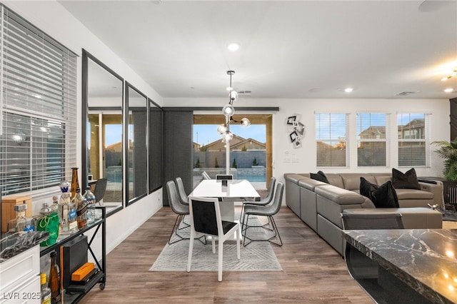 2833 Sangro Ct, Henderson, NV 89044 - dining room featuring wood finished floors, recessed lighting, and a chandelier