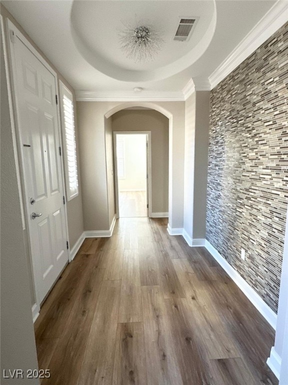 776 Tillis Pl, Las Vegas, NV 89138 - hallway with arched walkways, wood finished floors, crown molding, and a tray ceiling