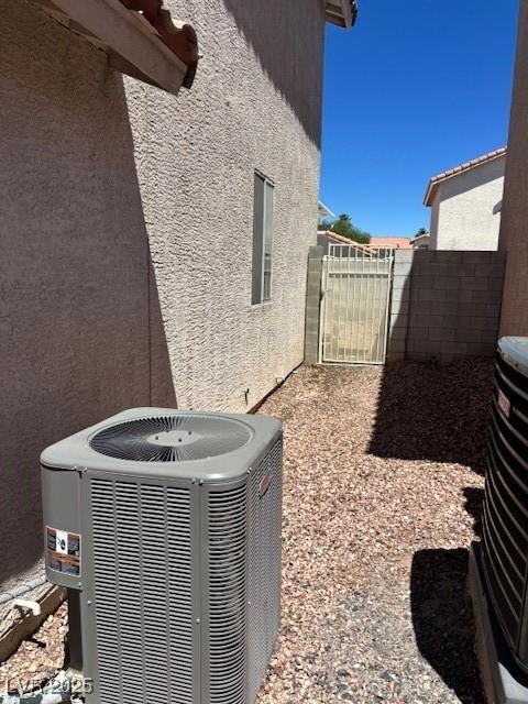 9940 Trailing Vine St, Las Vegas, NV 89183 - exterior view of stucco siding and a gate