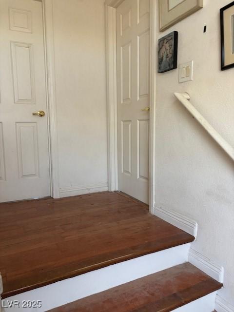 9940 Trailing Vine St, Las Vegas, NV 89183 - stairway with wood finished floors and baseboards