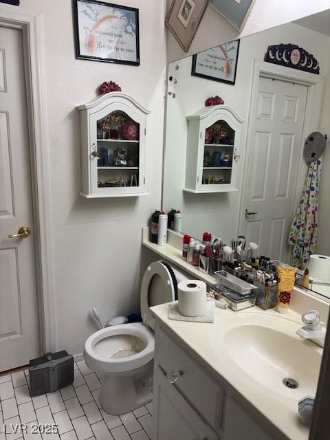 9940 Trailing Vine St, Las Vegas, NV 89183 - bathroom with tile patterned flooring and vanity