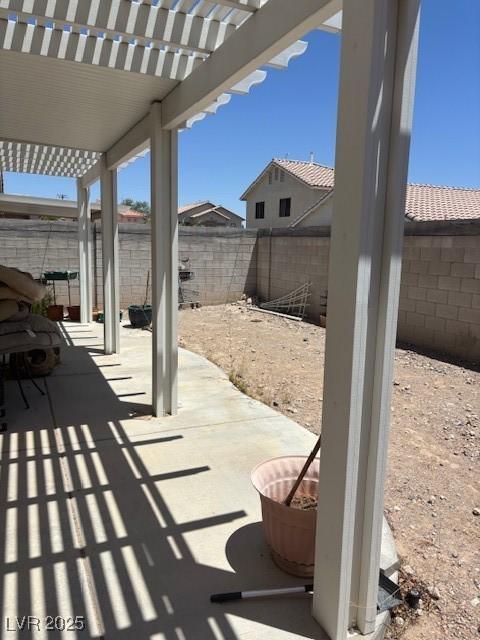 9940 Trailing Vine St, Las Vegas, NV 89183 - fenced backyard with a pergola and a patio