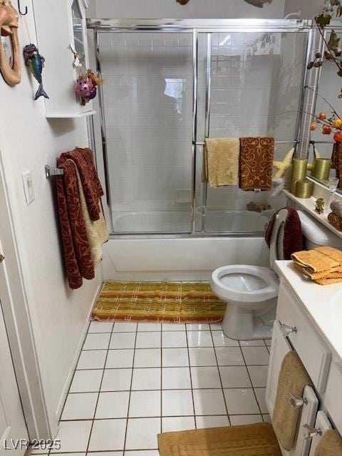 9940 Trailing Vine St, Las Vegas, NV 89183 - bathroom with vanity, bath / shower combo with glass door, and tile patterned floors