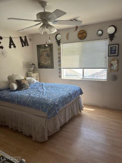 9940 Trailing Vine St, Las Vegas, NV 89183 - bedroom with light wood-style flooring and a ceiling fan