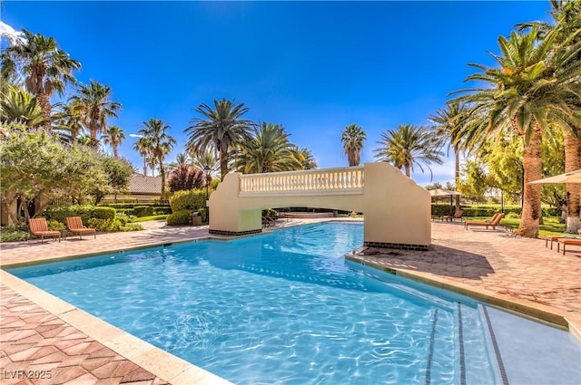 2050 W Warm Springs Rd Unit 1923, Henderson, NV 89014 - community pool featuring a patio