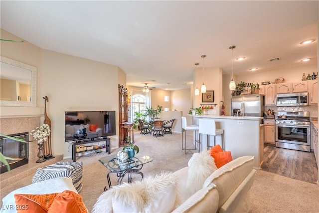 2050 W Warm Springs Rd Unit 1923, Henderson, NV 89014 - living room featuring carpet flooring, a tiled fireplace, and recessed lighting