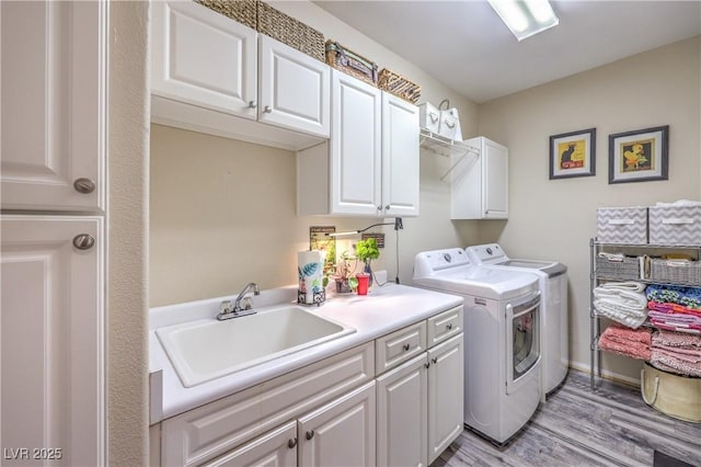 2050 W Warm Springs Rd Unit 1923, Henderson, NV 89014 - laundry area with cabinet space, washing machine and dryer, and light wood finished floors
