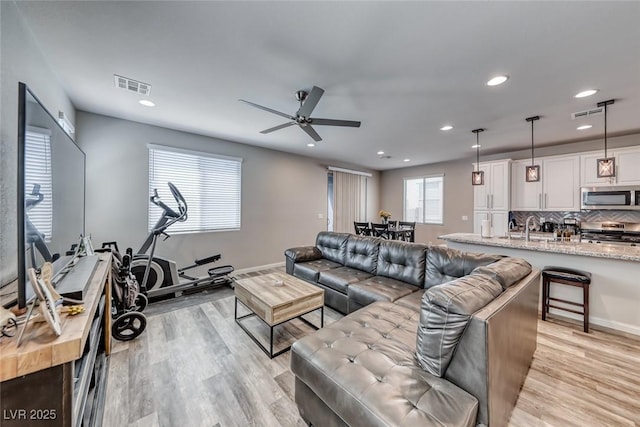 6335 Pacific Sky St, North Las Vegas, NV 89081 - living room featuring recessed lighting, light wood-style flooring, and a ceiling fan