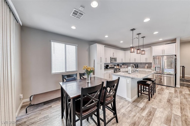 6335 Pacific Sky St, North Las Vegas, NV 89081 - dining room featuring light wood-style floors and recessed lighting