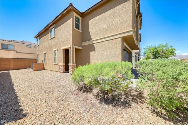 6335 Pacific Sky St, North Las Vegas, NV 89081 - rear view of house with stucco siding
