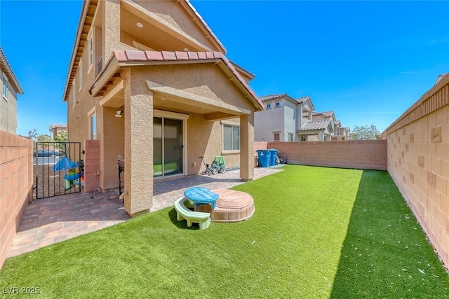 6335 Pacific Sky St, North Las Vegas, NV 89081 - rear view of property with stucco siding, a fenced backyard, a patio area, and a gate