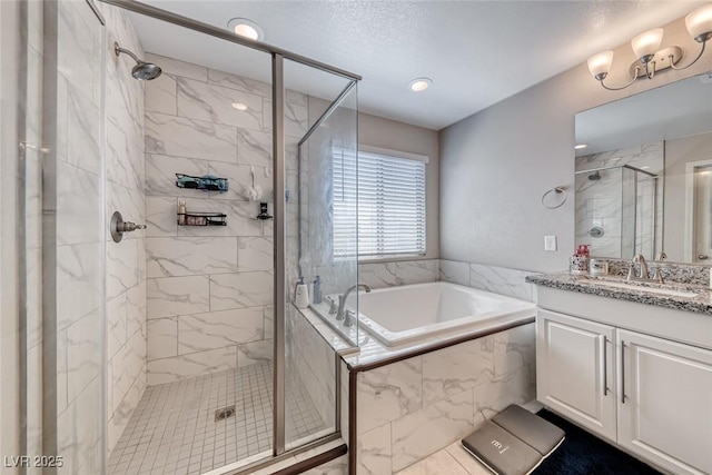 6335 Pacific Sky St, North Las Vegas, NV 89081 - full bathroom featuring vanity, a garden tub, a shower stall, and recessed lighting