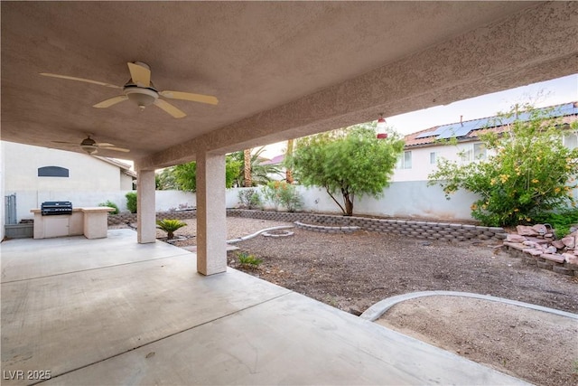 1206 Evening Canyon Ave, Henderson, NV 89014 - fenced backyard with ceiling fan, a patio, and area for grilling