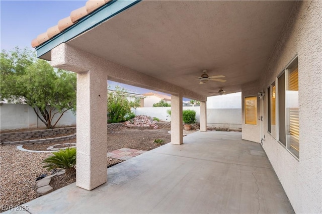 1206 Evening Canyon Ave, Henderson, NV 89014 - fenced backyard featuring a ceiling fan and a patio