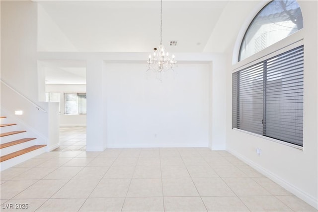 1206 Evening Canyon Ave, Henderson, NV 89014 - tiled empty room featuring a chandelier and stairs